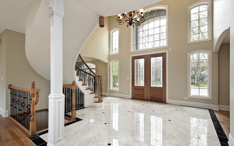 Foyer and circular staircase in new construction home